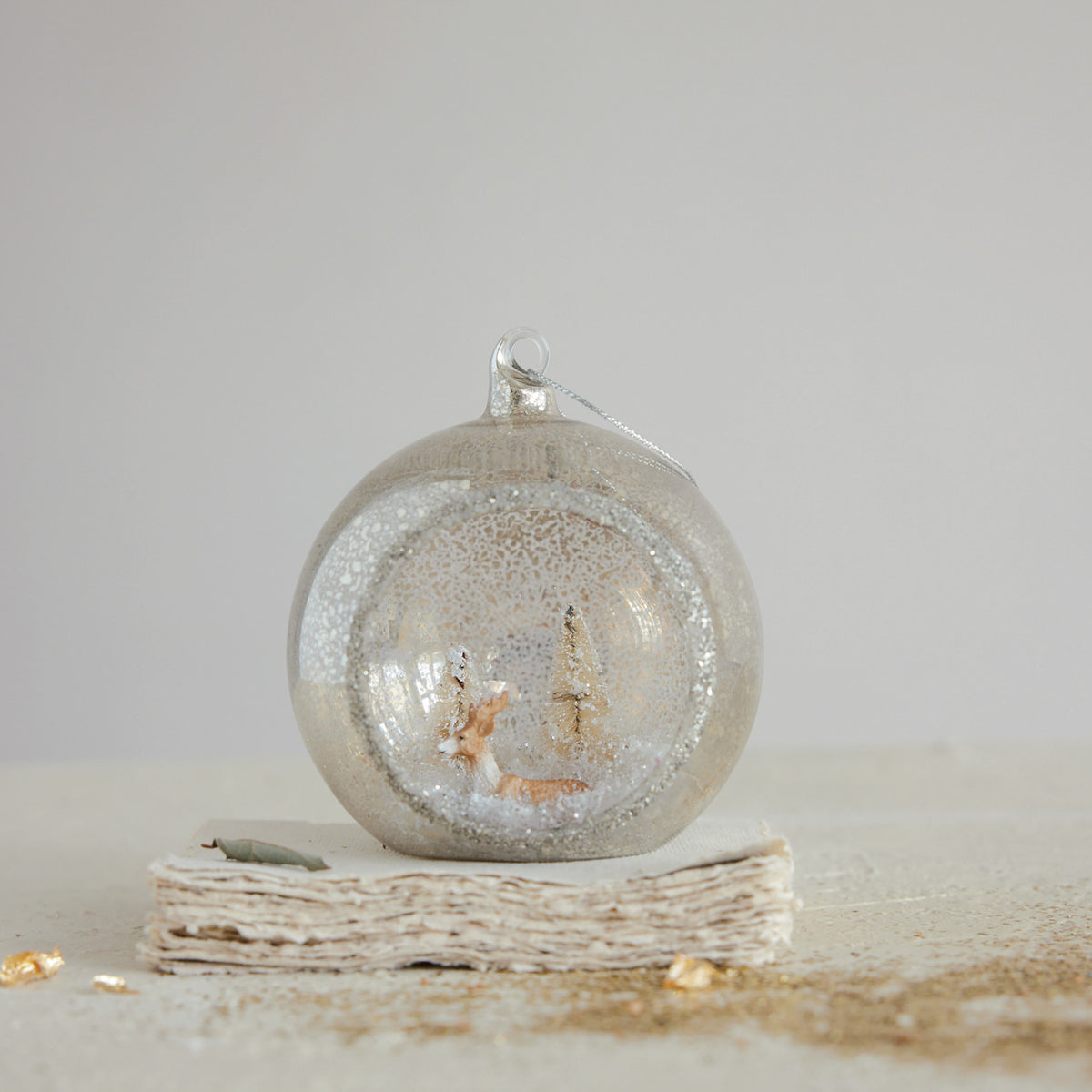 Mercury Glass Diorama Ornament with Deer, Bottle Brush Trees & Glitter, Beige & White
