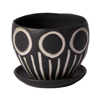 The Hootie Hoo Pot adds the fun to any decor with a smooth black matte finish with added hand-painted in bone white circle and stem design. Dimensions: 7" x 7" x 5.50" Material: Ceramic
