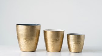 Enameled Planters with a Matte Brass Finish. Perfect Glam for any Green plant. Three size for a perfect fit. Small: 7" Round x 6"H (Holds 6" Pots) Medium: 8" Round x 7"H (Holds 7" Pots) Large: 9" Round x 10"H (Holds 8" Pots)
