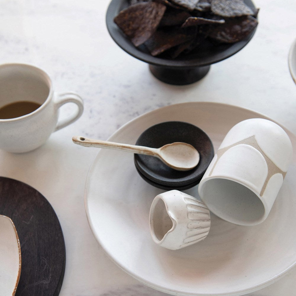 Need a special spoon for serving your favorite spread or dip. This 5-3/4"L Stoneware Spoon with a Reactive Glaze finish in white or black is the perfect choice. Each One Will Vary.
