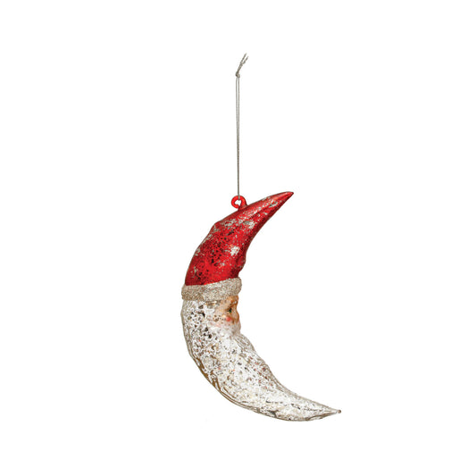 Decorative ornament shaped like a crescent moon with a red hat on a white background
