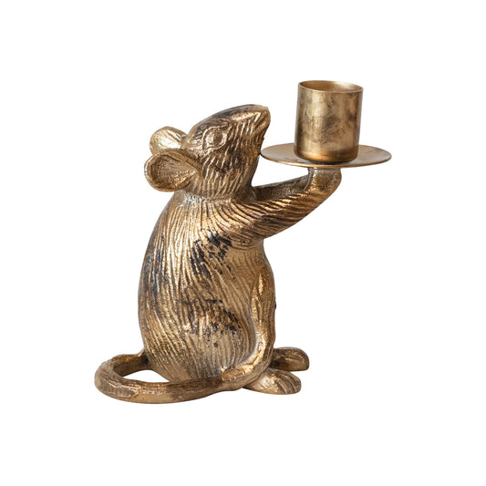 Gold mouse-shaped candle holder on a white background