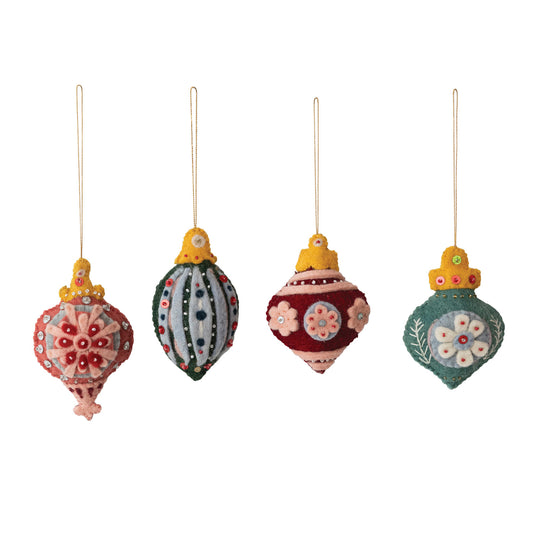 four colorful Christmas ornaments on a white background. each sold separately