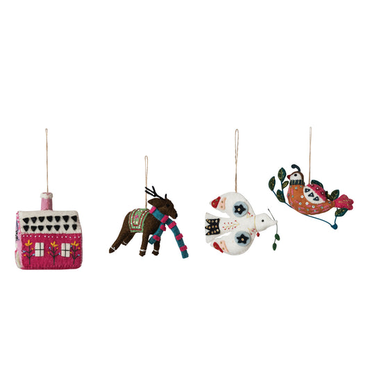 four colorful felt Christmas ornaments on a white background