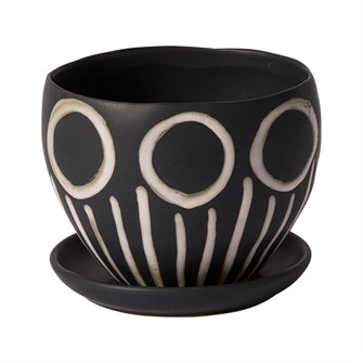 The Hootie Hoo Pot adds the fun to any decor with a smooth black matte finish with added hand-painted in bone white circle and stem design.  Dimensions: 7" x 7" x 5.50" Material: Ceramic