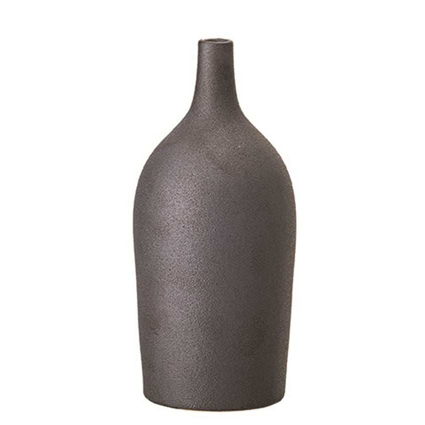 The Matte Black 4" Round x 8-3/4"H Stoneware Vase with a Reactive Glaze finish brings a simplistic design to your room. Add a unique botanical to spice up your décor. Each One Will Vary.