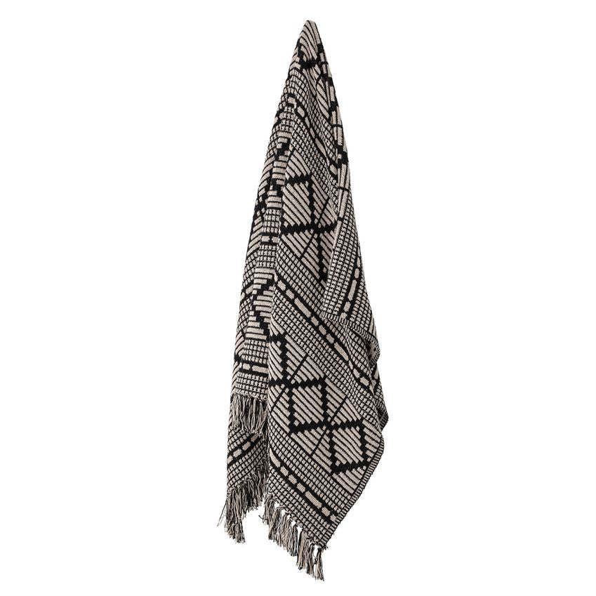 Adding this 60"L x 50"W Woven Recycled Cotton Blend Throw with Fringe in Black & Beige tone to your home décor will add a touch of Boho and layers to any room. Makes the perfect light wrap on a cool night around the fire pit.