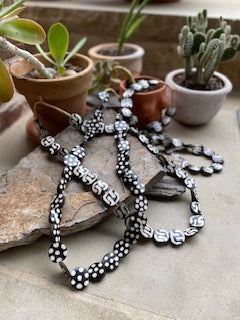 Bone Beads are perfect for a night on the town or use them in your home decor.  Put them around a vase or lamp or just lay with other unique finds. Patterns vary - Flat Beads.