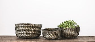 The Hand-Woven Grass Baskets in Natural & Black colors are perfect for displaying fruit, your favorite Boho bangles, or keeping a place for your tv remote.  Comes in three sizes; each sold separately.  Small: 6-3/4"Round x 3-1/2"H Medium: 8-1/4" Round x 4-1/4"H Large: 10" Round x 5"H