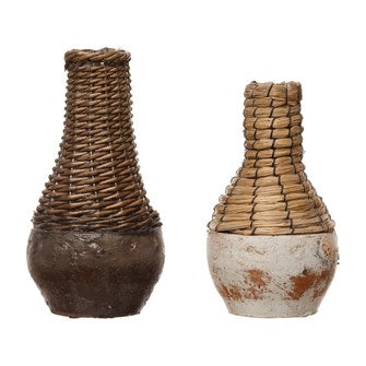 These Distressed Finished 4" Round x 6-1/2"H Hand-Woven Rattan & Clay Vase are perfect for any table top or shelf. Comes in 2 Colors. (Each One Will Vary)