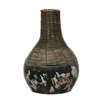 These Distressed Black, Hand-Woven Rattan & Clay Vase are perfect for any coffee table or table arrangement. Add your favorite botanical to complete your style. (Each One Will Vary) Small: 6-3/4" Round x 9"H Large: 8-1/2" Round x 11-3/4"H