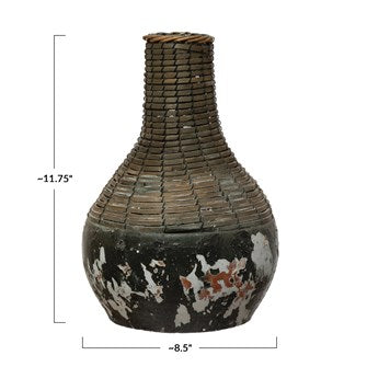 These Distressed Black, Hand-Woven Rattan & Clay Vase are perfect for any coffee table or table arrangement. Add your favorite botanical to complete your style. (Each One Will Vary) Small: 6-3/4" Round x 9"H Large: 8-1/2" Round x 11-3/4"H